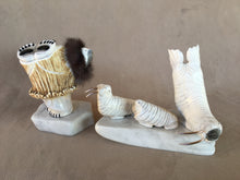 Load image into Gallery viewer, A six piece Elk antler set of a polar bear wearing a parka with a rabbit ruff. His eyes, claws and paws are inlaid pen shell. There are three walrus. A father and mother with sterling silver tusks and the third a calf with no tusks. Two white italian marble serve as icebergs. 