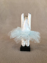 Load image into Gallery viewer, A Ballerina Bear inspired by the Nut Cracker Play. This Bear is on its toes and arms up to the sky. She wears a light blue Tutu. Standing on a Belgium Black Marble base. 